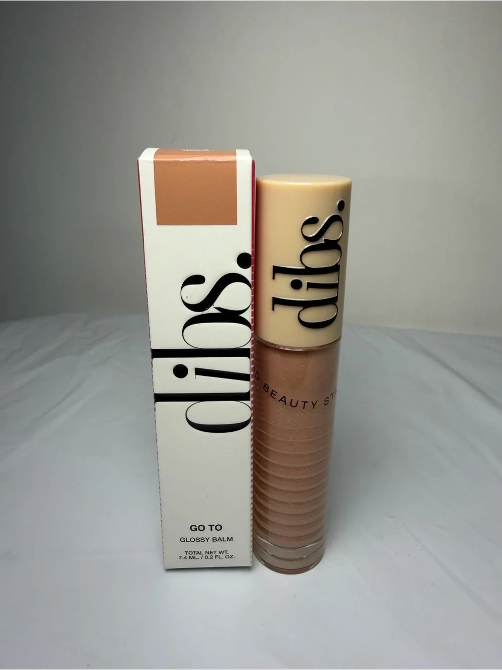 Dibs Go To Glossy Balm Lip Gloss - KISS Me Quick color